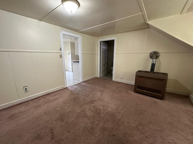 additional living space featuring carpet flooring