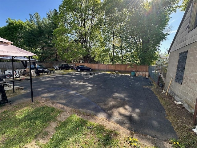 exterior space featuring fence and a gazebo