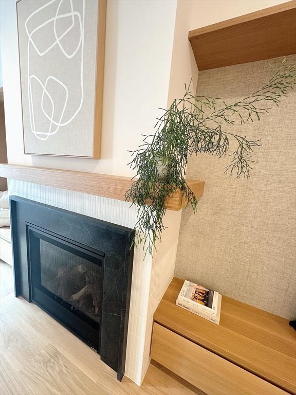 8A Milk St Unit 1, Newburyport, MA 01950 - detailed view of wood finished floors and a tile fireplace