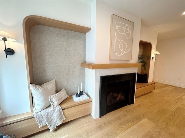 8A Milk St Unit 1, Newburyport, MA 01950 - living area with wood finished floors and a fireplace