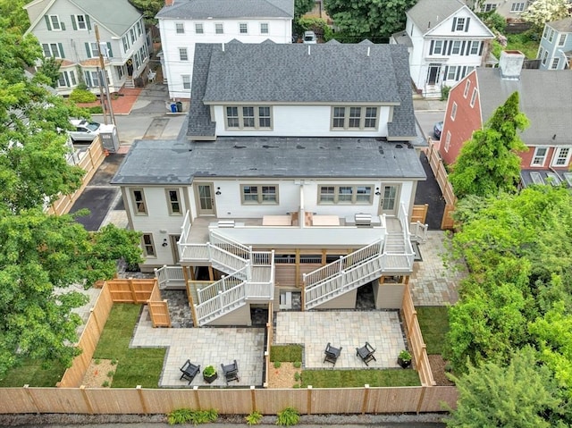 8A Milk St Unit 1, Newburyport, MA 01950 - rear view of house with stairs, a fenced backyard, and a patio
