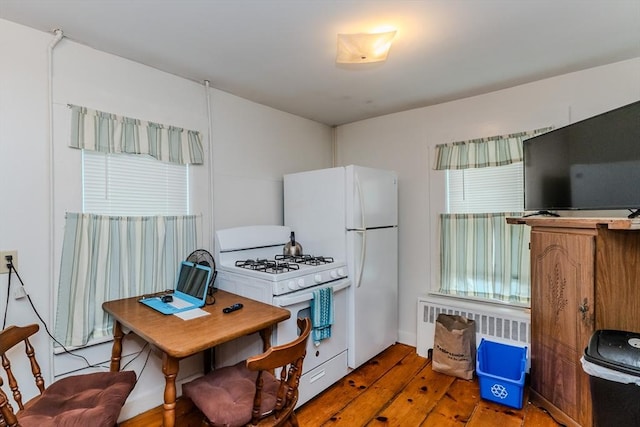 16 Fairfield Ave, Northampton, MA 01062 - kitchen featuring white appliances, hardwood / wood-style floors, a desk, and radiator
