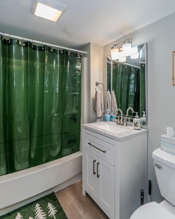 16 Fairfield Ave, Northampton, MA 01062 - bathroom featuring toilet, vanity, shower / tub combo with curtain, and wood finished floors