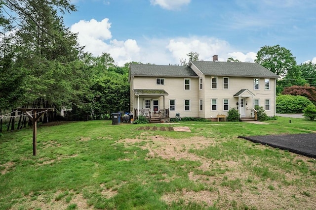 16 Fairfield Ave, Northampton, MA 01062 - back of property featuring a lawn, a chimney, and a deck