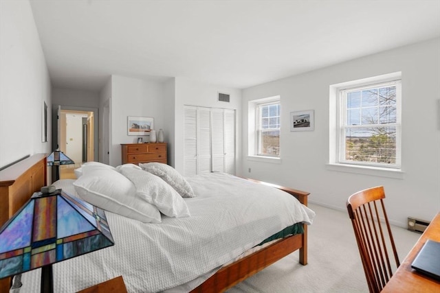 456 Belmont St Unit 21, Watertown, MA 02472 - carpeted bedroom featuring a closet, baseboards, and visible vents