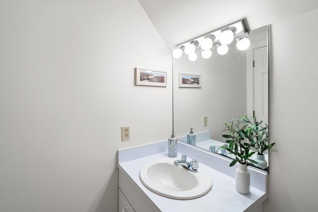 456 Belmont St Unit 21, Watertown, MA 02472 - bathroom featuring vanity and vaulted ceiling