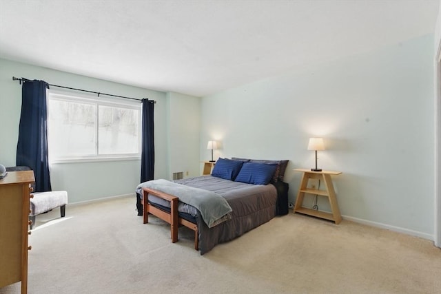 bedroom with baseboards and carpet flooring