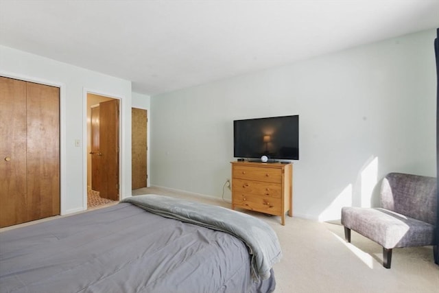 carpeted bedroom with baseboards