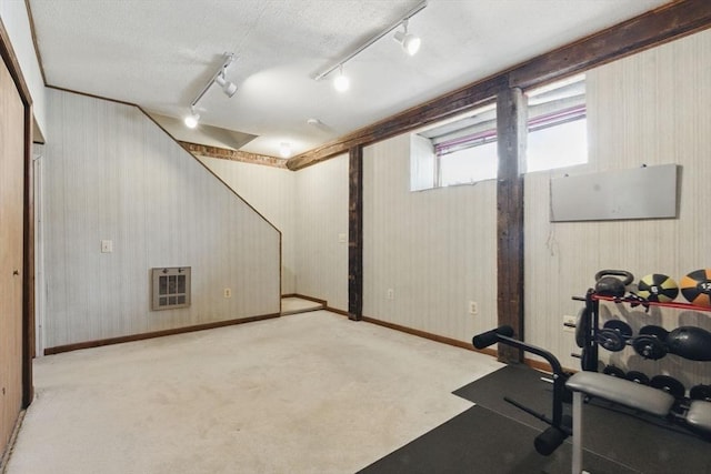 workout room with carpet flooring and baseboards