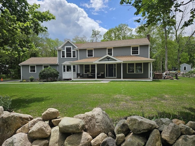 355 Tilden Rd, Scituate, MA 02066 - back of house featuring a lawn and a chimney