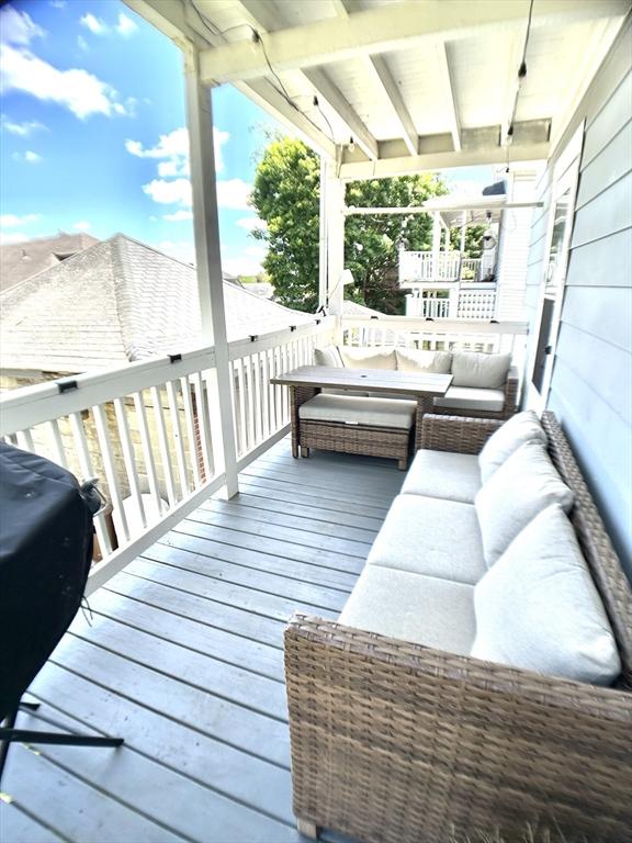 22-24 Ellison Ave Unit 1, Boston, MA 02126 - wooden deck with an outdoor hangout area and a grill