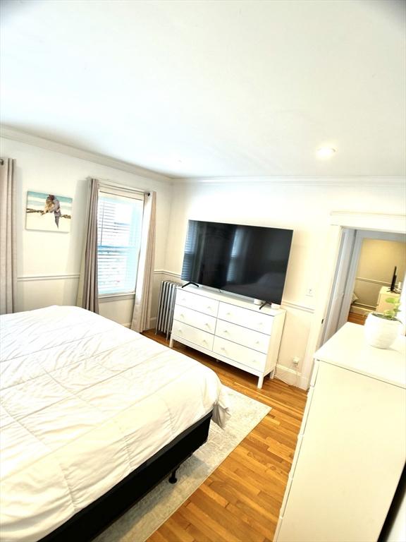22-24 Ellison Ave Unit 1, Boston, MA 02126 - bedroom featuring ornamental molding, light wood finished floors, and recessed lighting