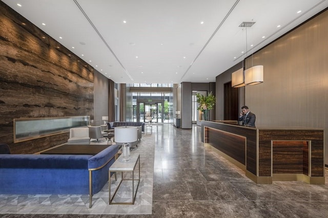 reception area with a glass covered fireplace