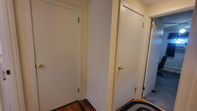 1285 Pendleton Ave Unit 1285, Chicopee, MA 01022 - corridor featuring a baseboard heating unit and dark wood finished floors