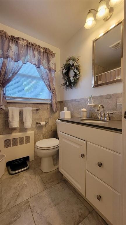 1285 Pendleton Ave Unit 1285, Chicopee, MA 01022 - full bathroom featuring radiator, tile walls, and vanity