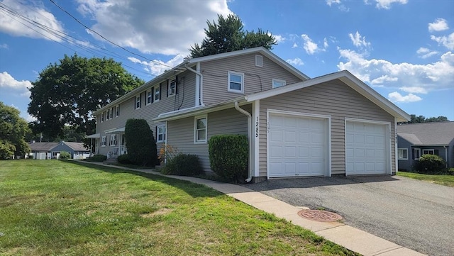 1285 Pendleton Ave Unit 1285, Chicopee, MA 01022 - view of side of property with a yard and a garage
