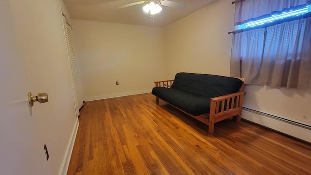 1285 Pendleton Ave Unit 1285, Chicopee, MA 01022 - living area featuring a ceiling fan, wood finished floors, and a baseboard radiator