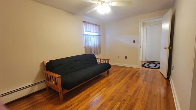 1285 Pendleton Ave Unit 1285, Chicopee, MA 01022 - sitting room featuring a baseboard radiator, wood finished floors, and a ceiling fan