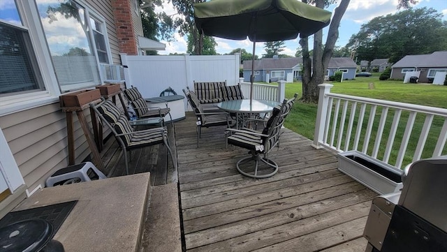1285 Pendleton Ave Unit 1285, Chicopee, MA 01022 - deck featuring a lawn, outdoor dining area, and a residential view