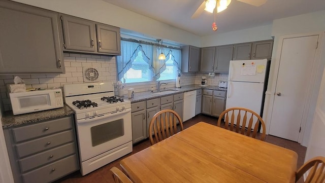1285 Pendleton Ave Unit 1285, Chicopee, MA 01022 - kitchen featuring white appliances, gray cabinets, decorative backsplash, ceiling fan, and dark stone countertops