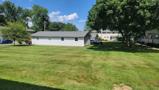 1285 Pendleton Ave Unit 1285, Chicopee, MA 01022 - view of property exterior featuring a yard