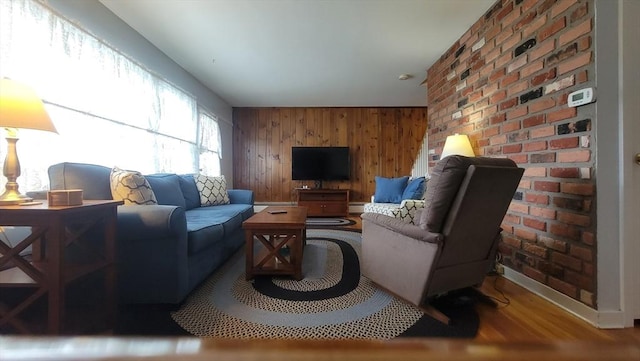 1285 Pendleton Ave Unit 1285, Chicopee, MA 01022 - living area featuring wood finished floors, wooden walls, and baseboard heating