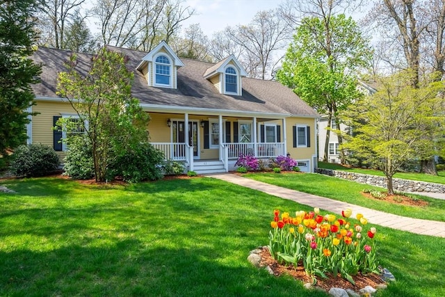 new england style home with a front lawn and a porch