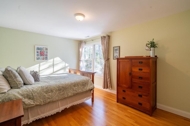 bedroom with light hardwood / wood-style floors