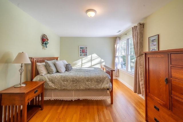 bedroom with light hardwood / wood-style floors