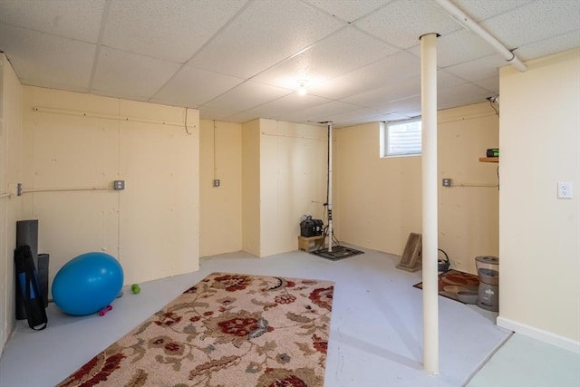 workout room with a paneled ceiling