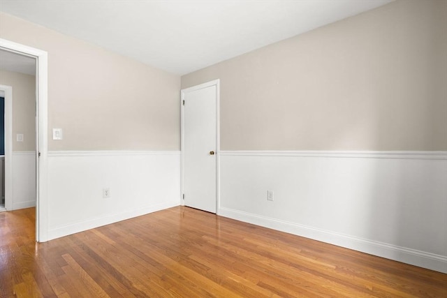 56 Beach St, Woburn, MA 01801 - empty room with wood finished floors and baseboards