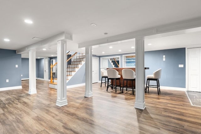 56 Beach St, Woburn, MA 01801 - finished basement with wood finished floors, bar, stairs, and recessed lighting