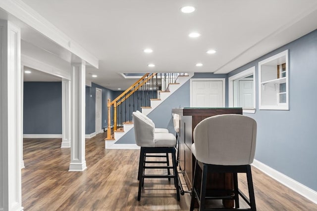 56 Beach St, Woburn, MA 01801 - dining area with decorative columns, recessed lighting, stairway, and wood finished floors