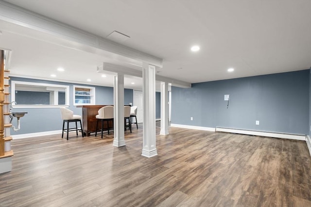 56 Beach St, Woburn, MA 01801 - finished basement with a baseboard radiator, wood finished floors, and recessed lighting