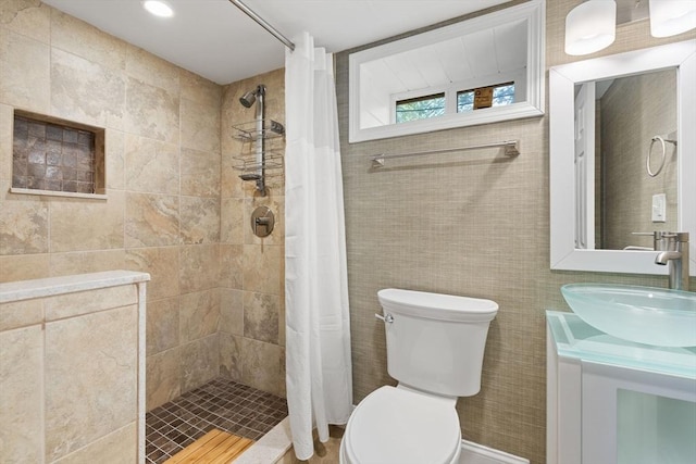 56 Beach St, Woburn, MA 01801 - full bath featuring tiled shower, vanity, and tile walls