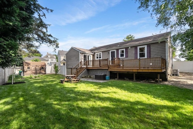 56 Beach St, Woburn, MA 01801 - rear view of house featuring a deck and a fenced backyard