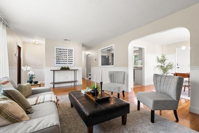 56 Beach St, Woburn, MA 01801 - living area with arched walkways and wood finished floors