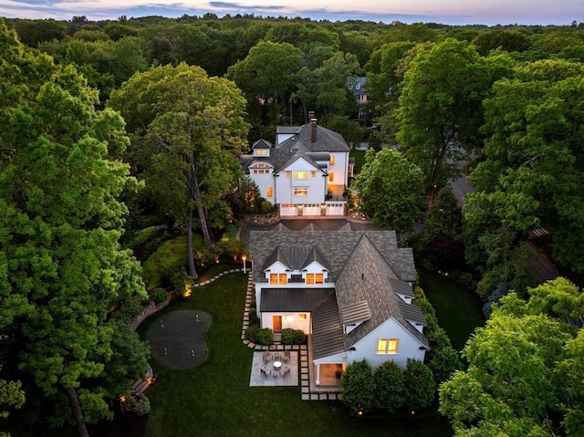 aerial view at dusk with a forest view