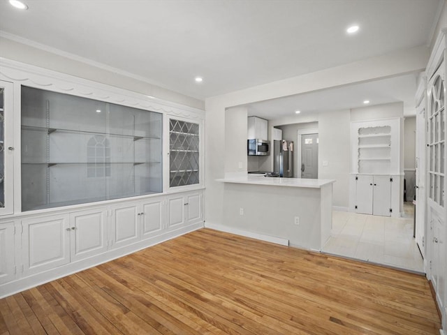 unfurnished living room featuring light hardwood / wood-style floors