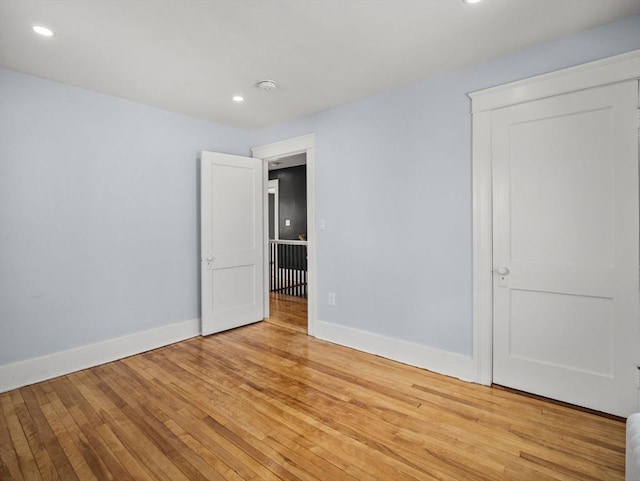 empty room with light hardwood / wood-style floors