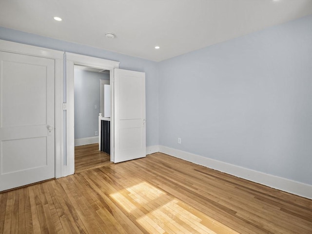 unfurnished bedroom with wood-type flooring