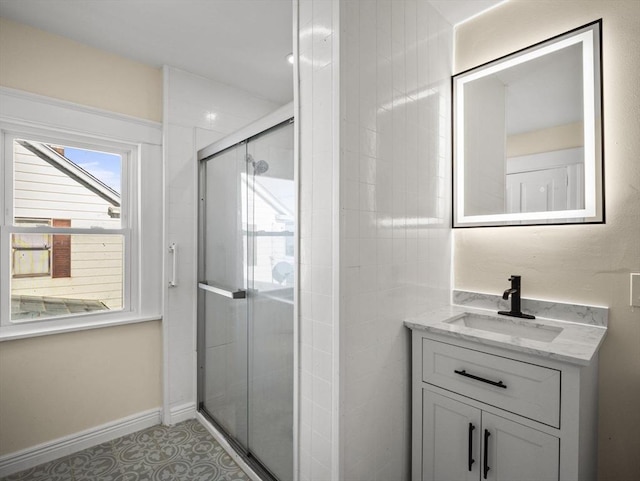 bathroom with vanity and walk in shower