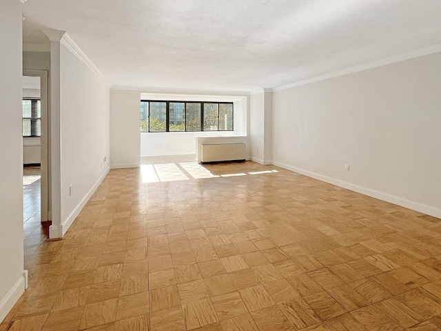 unfurnished room with light parquet floors, ornamental molding, and plenty of natural light