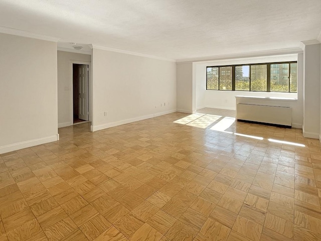 unfurnished room with light parquet floors and ornamental molding