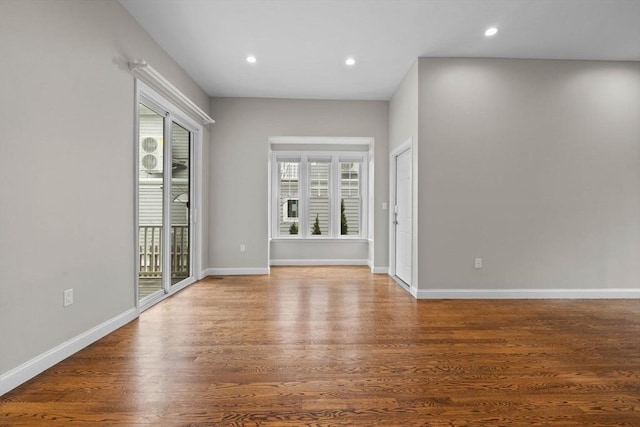63 Perrin St, Boston, MA 02119 - empty room with wood finished floors, recessed lighting, and baseboards