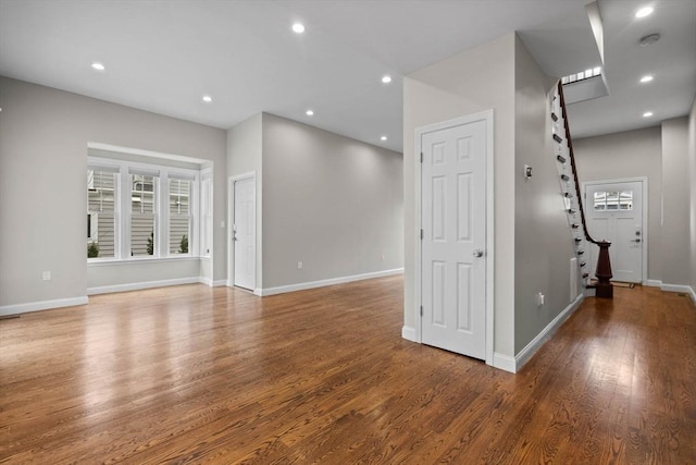 63 Perrin St, Boston, MA 02119 - unfurnished room with wood finished floors, baseboards, plenty of natural light, and recessed lighting
