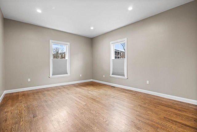 63 Perrin St, Boston, MA 02119 - spare room featuring light wood-style floors, baseboards, and recessed lighting
