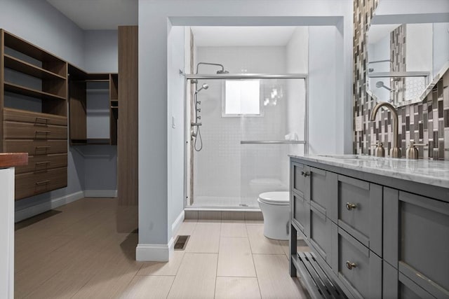 63 Perrin St, Boston, MA 02119 - full bathroom featuring toilet, a stall shower, vanity, baseboards, and tile patterned flooring