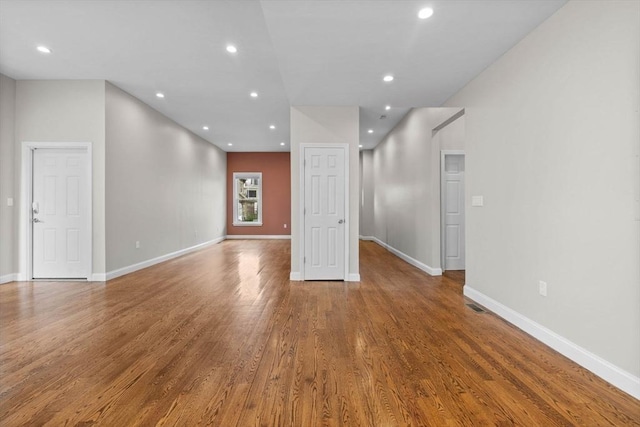 63 Perrin St, Boston, MA 02119 - empty room with wood finished floors, recessed lighting, and baseboards
