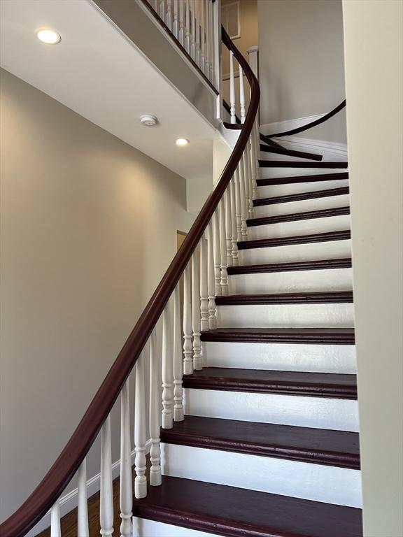 63 Perrin St, Boston, MA 02119 - staircase featuring recessed lighting